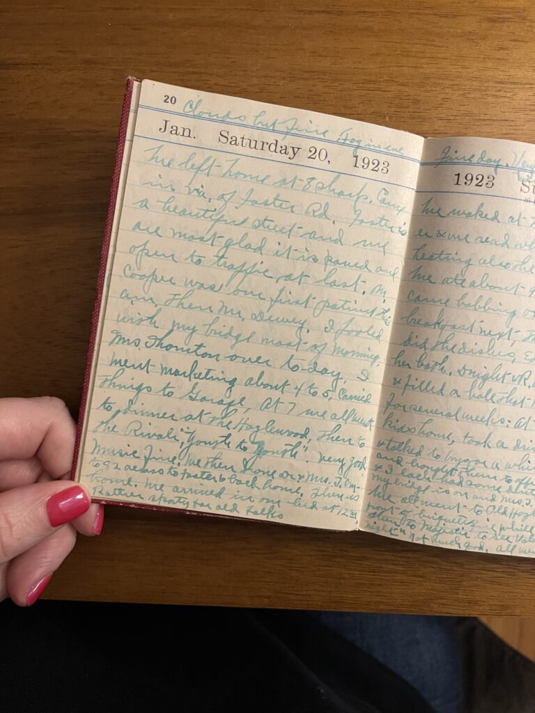 A page-a-day diary from 1923 opened to the entry for Saturday, January 20, 1923. The entry is written in cursive and in pen that's faded to a green-ish color. 