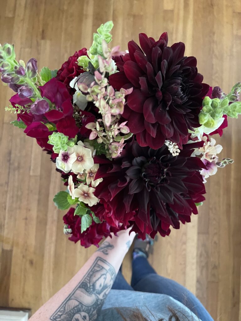 Close-up view of a beautiful bouquet of red dahlias. 