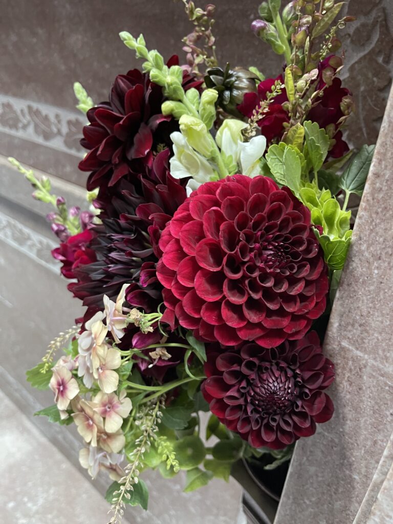 Close-up view of a beautiful bouquet of red dahlias. 