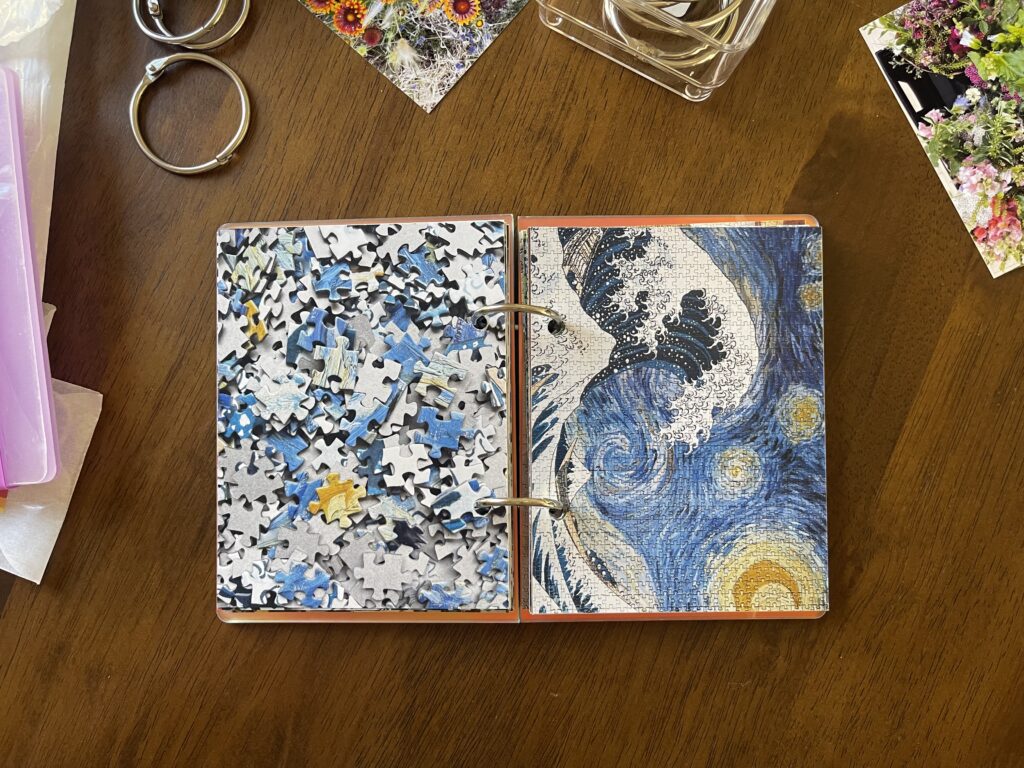 Spread #11. The left-hand page is a photo of the puzzle's unpuzzled pieces. The right-hand page is a photo of the completed puzzle of a mash-up of Hokusai's The Great Wave and van Gogh's Starry Night. 